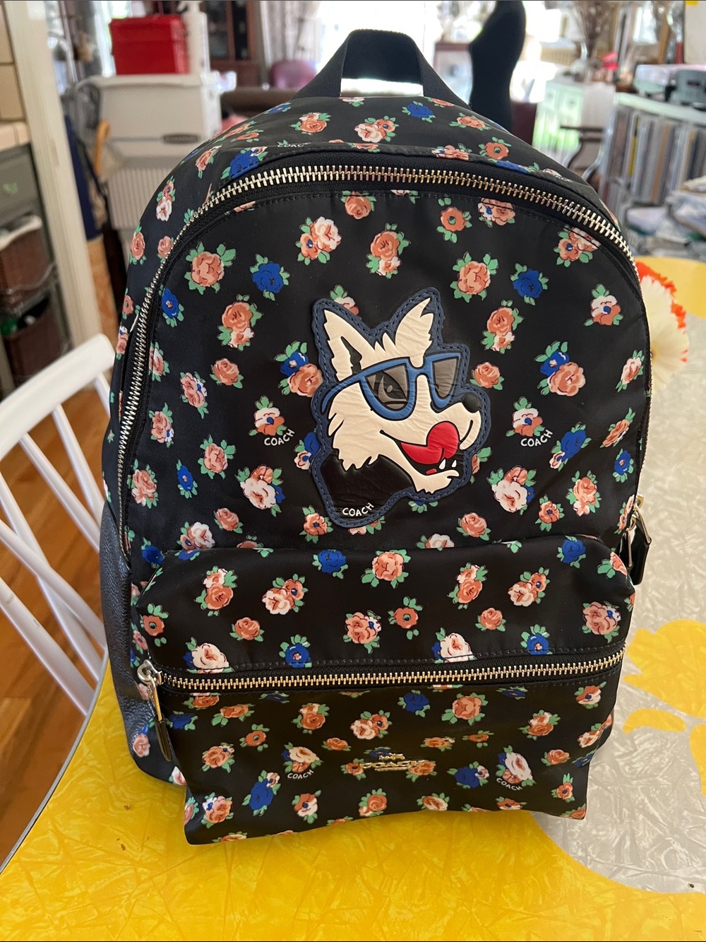 Coach Black Floral Backpack with Fox Patch and Blue Sunglasses